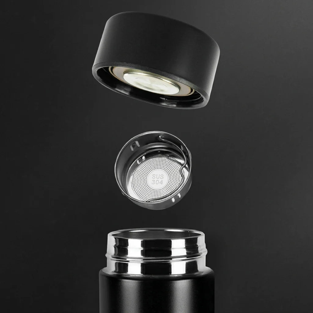 An exploded view of a black stainless steel insulated water bottle showing the lid, a removable tea strainer, and the neck.