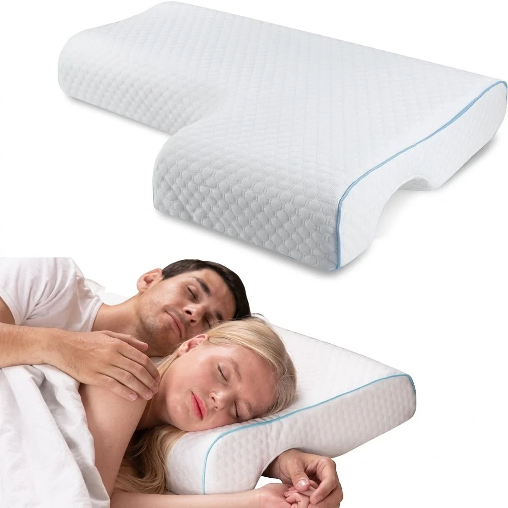 A couple sleeping comfortably on a white, ergonomic memory foam pillow with a unique tunnel design for arm placement.