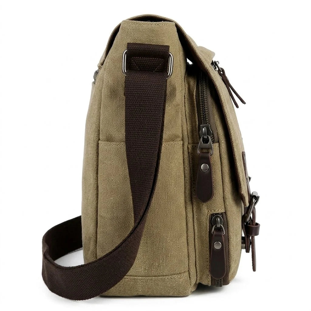 Side view of a khaki canvas messenger bag with a dark brown adjustable shoulder strap and metal hardware.