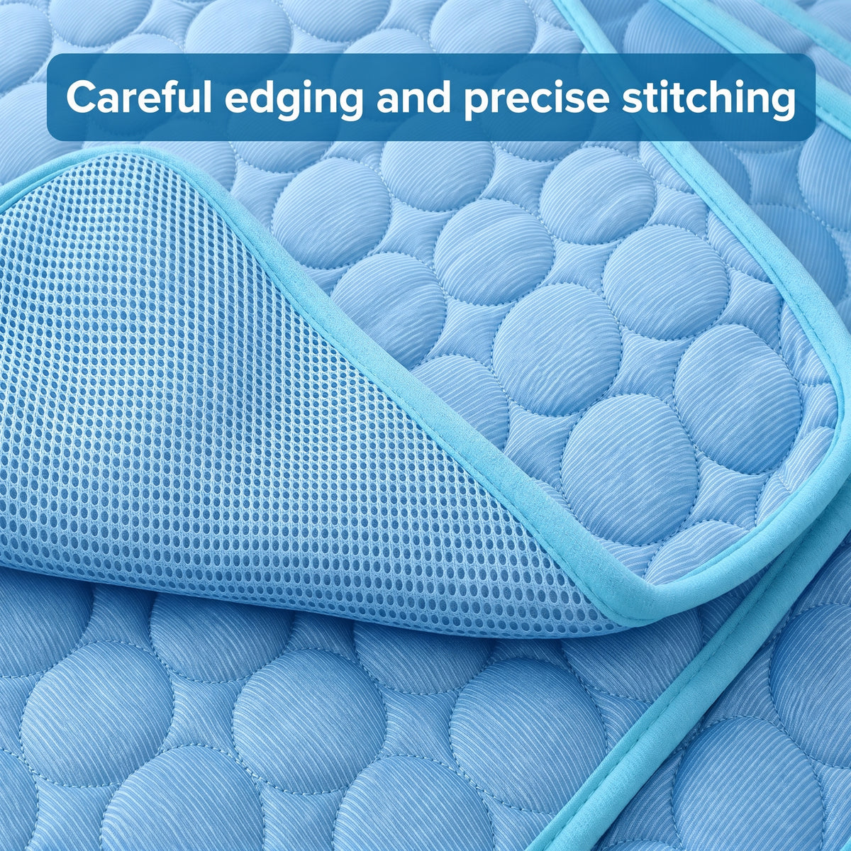 Close-up of a blue dog cooling mat showing the careful edging, precise stitching, and textured ice silk surface.