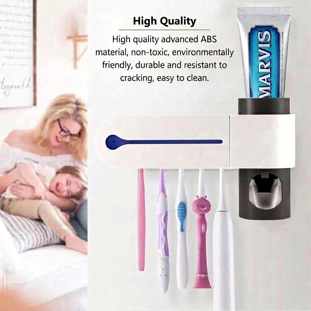 A white wall-mounted electric toothbrush holder with a built-in toothpaste dispenser, holding five brushes and a tube of Marvis.