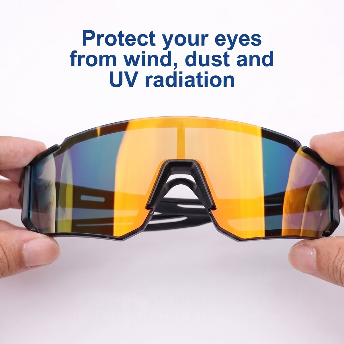 A pair of sleek, orange-tinted cycling sunglasses held up against a white background, protecting eyes from wind and UV rays.