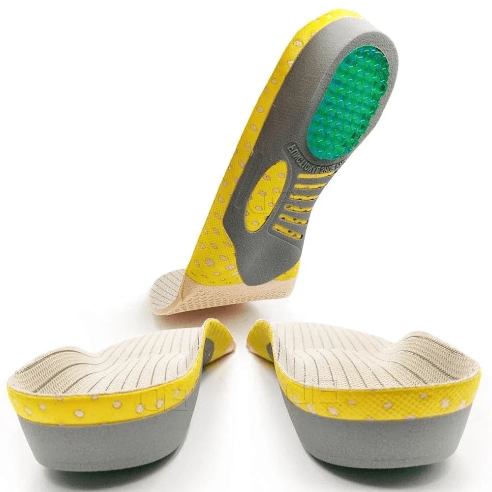 Three yellow and grey orthotic shoe insoles with green gel heel pads displayed against a white background.