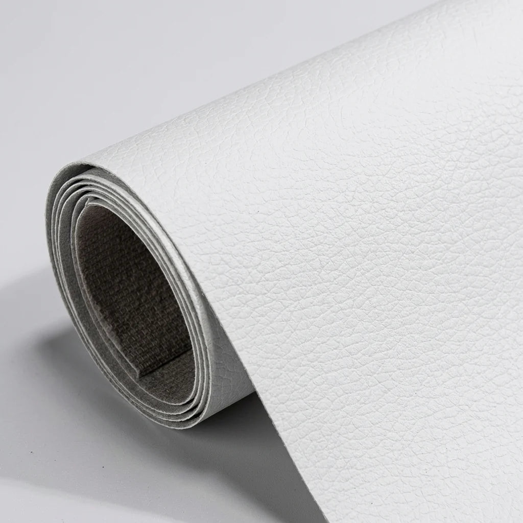 A roll of white, textured self-adhesive leather repair patch material shown against a plain light grey background.
