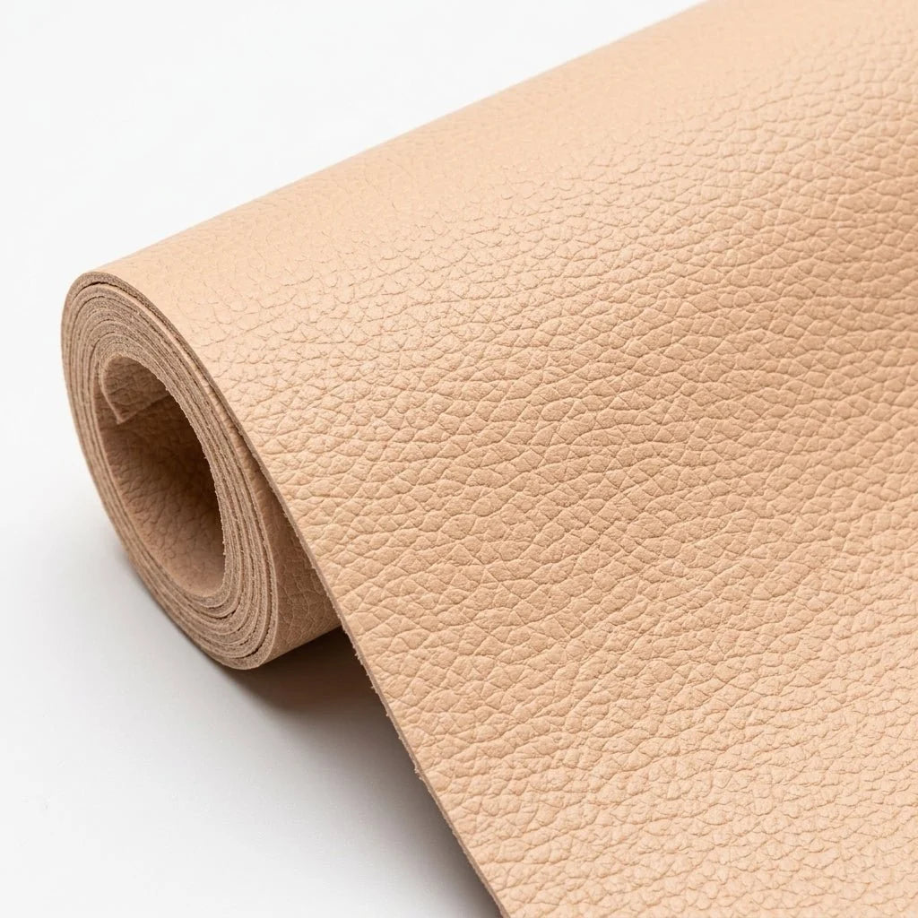 A roll of beige, textured self-adhesive leather repair patch material on a plain white background.