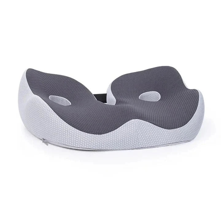 A grey memory foam chair cushion with a contoured design and two circular cut-outs for pressure relief.