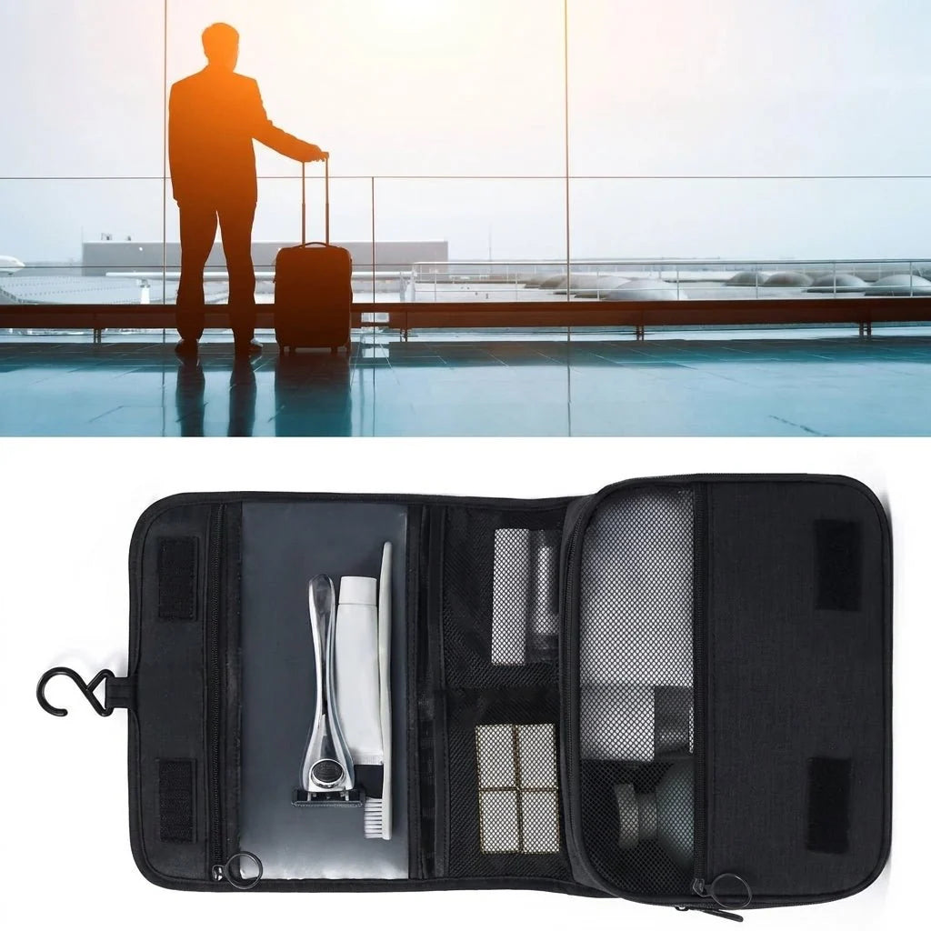 A silhouette of a traveller at an airport above an open black hanging toiletry bag containing a razor and grooming items.