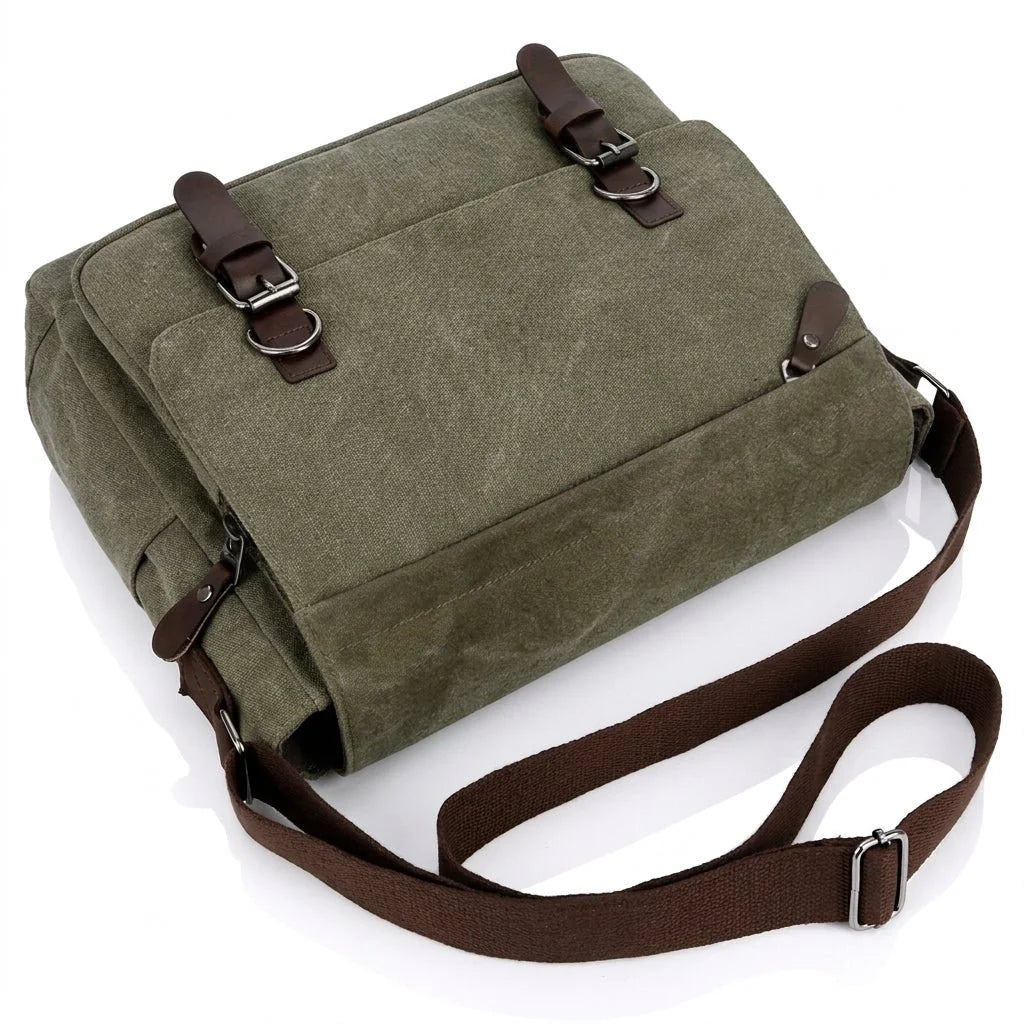 A green canvas messenger bag with brown leather-look straps and an adjustable shoulder strap, shown on a white background.