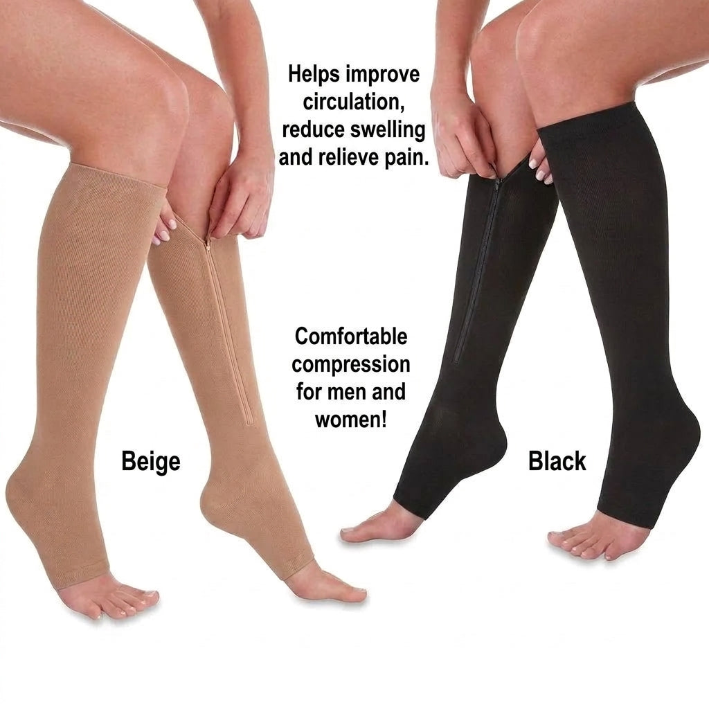 A pair of legs wearing beige and black open-toe compression socks with side zippers, shown against a white background.