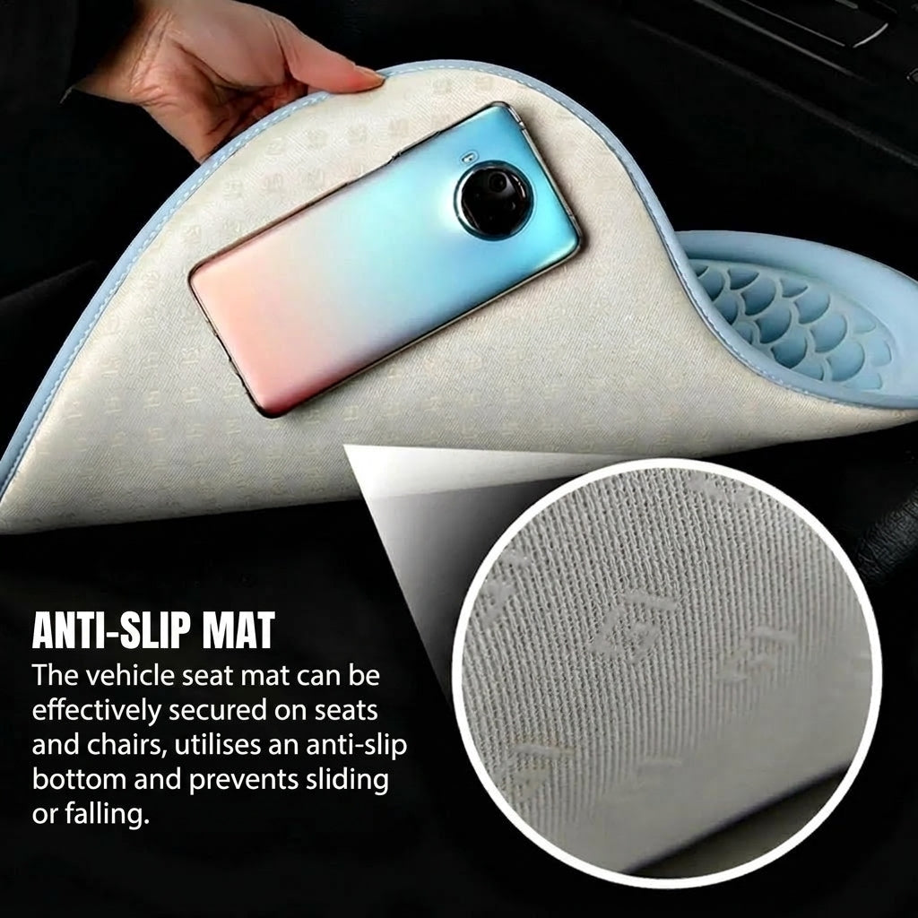 A hand holds a light blue cooling gel seat cushion with a textured, non-slip base, showing a smartphone placed on top.