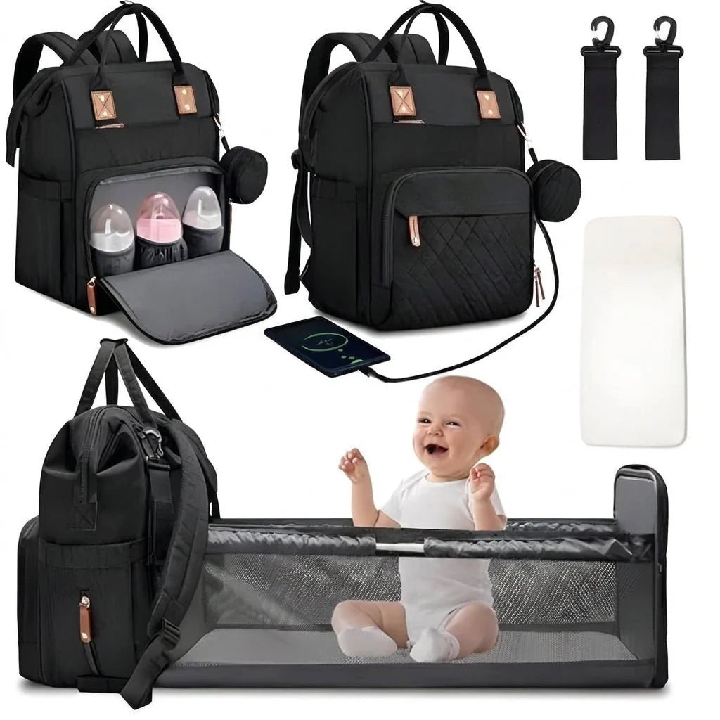 A black diaper bag backpack that unfolds into a portable baby travel cot, shown with a happy baby and accessories.