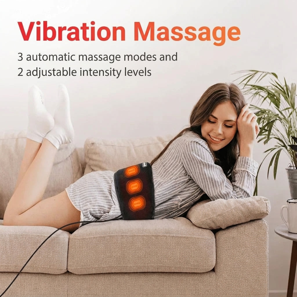 A woman lying on a couch wearing a vibrating heating belt around her waist to soothe her back.