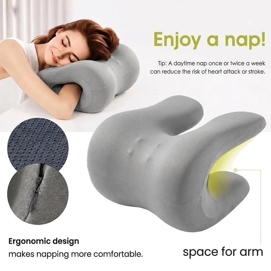 A woman rests her head on a grey ergonomic memory foam pillow featuring a dedicated space for a comfortable arm position.