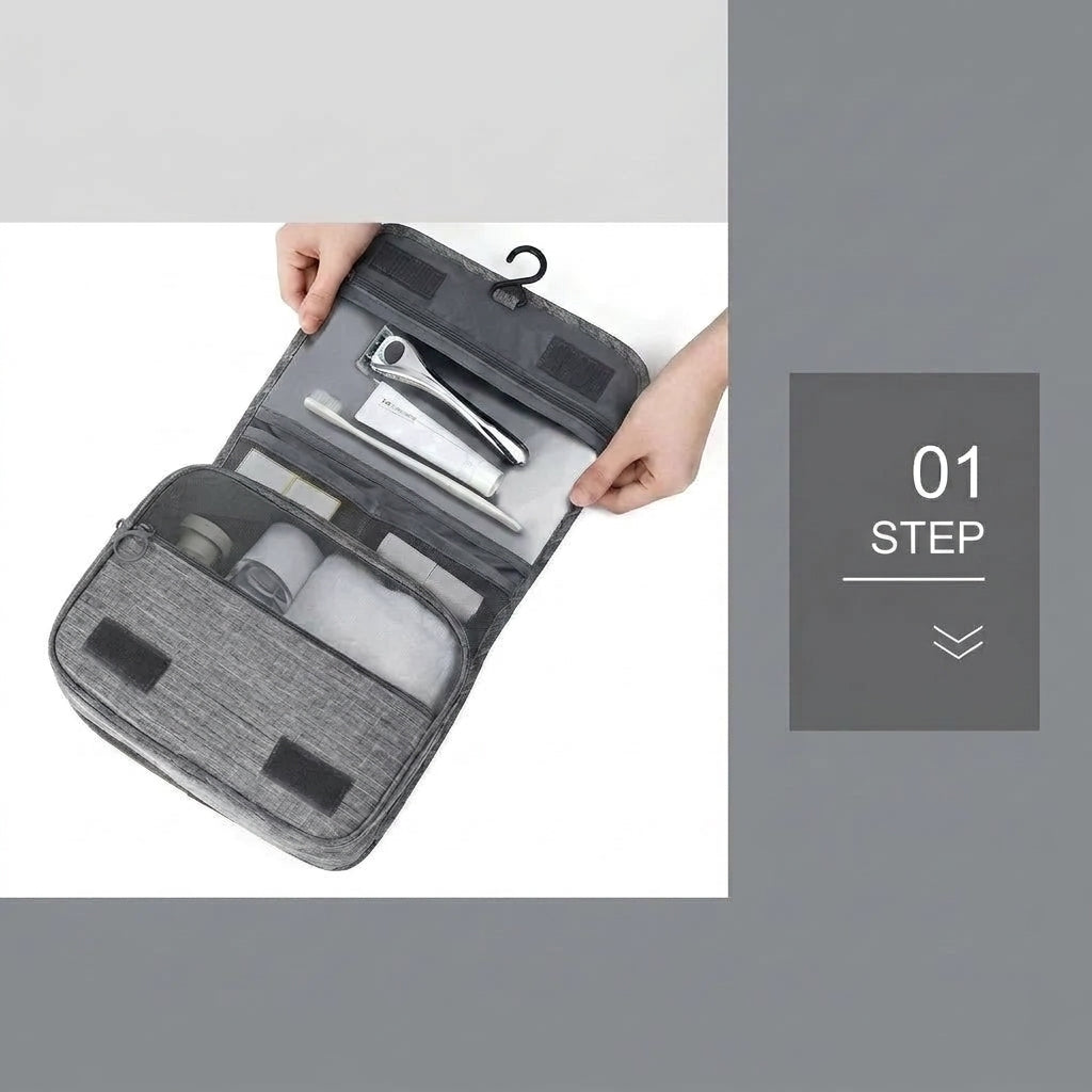 A person opening a grey hanging toiletry bag, showing internal compartments filled with travel-sized toiletries.