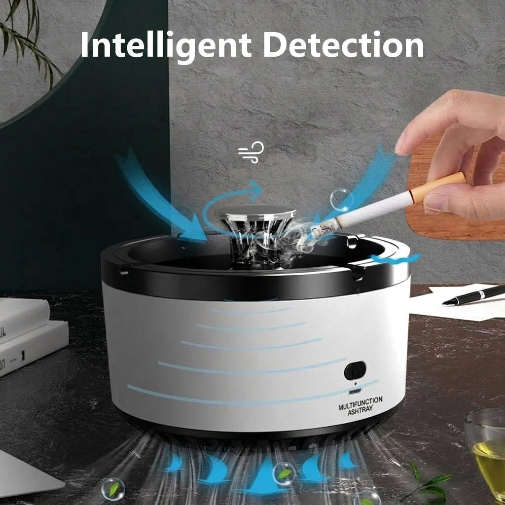 A white smokeless ashtray with a built-in fan and carbon filter, actively drawing in smoke from a lit cigarette.